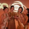 Equipe de Heart Code posa com troféus conquistados no ContentAsia Awards 2026 durante premiação de séries GL
